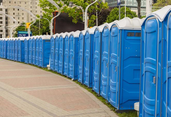 a line of portable restrooms at a sporting event, providing athletes and spectators with clean and accessible facilities in Sanford